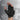 A gloved hand demonstrates a fingerless glove with padding in high contact areas and pull tabs for easy wear.